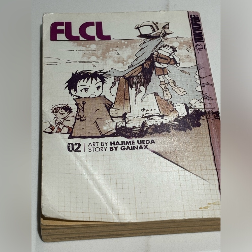 FLCL TOKYOPOP MANGA COMEDY, VOL. 2, HAJIME UEDA, GAINAX, 2003 Bent Front Cover